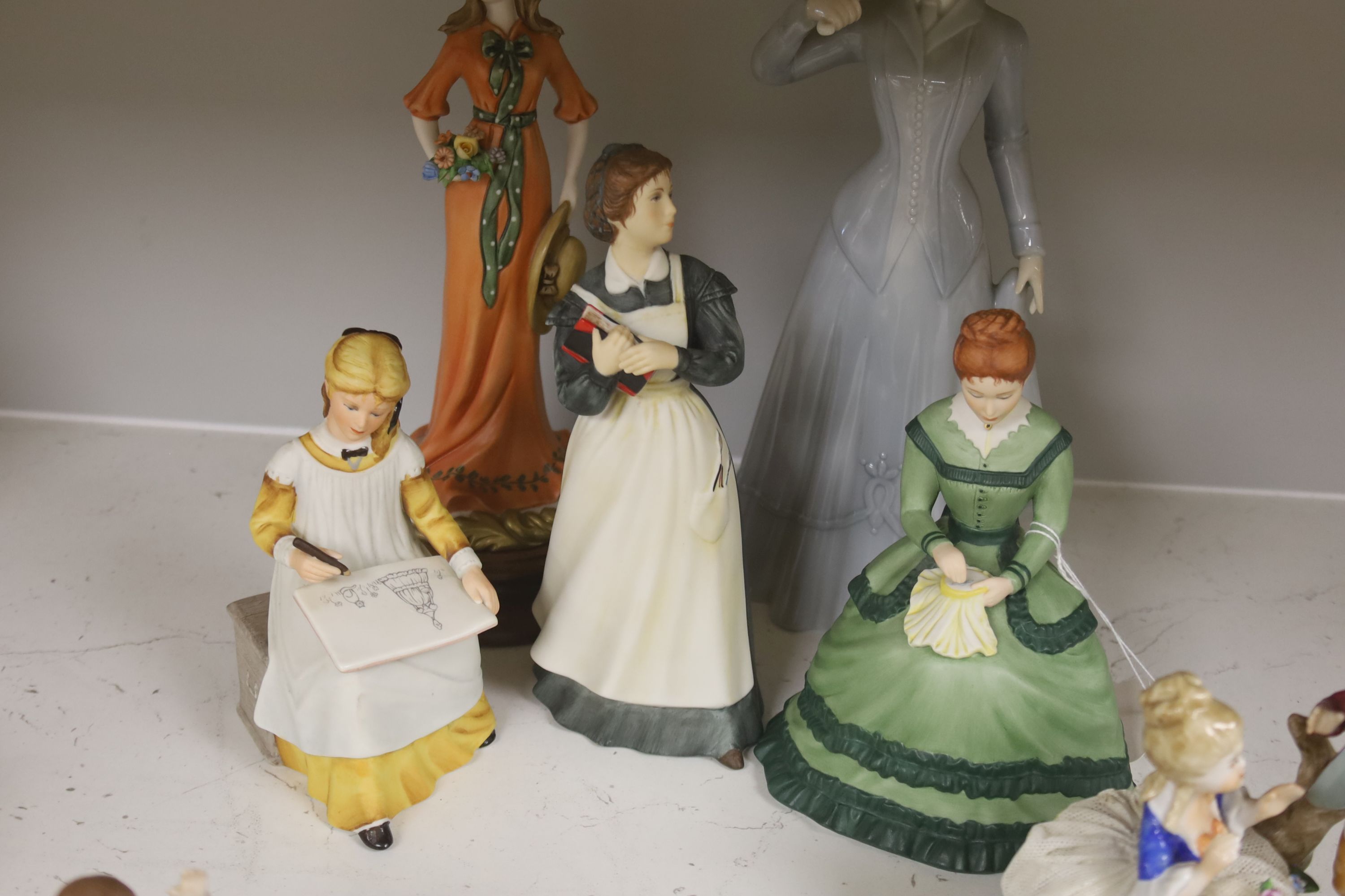 A German porcelain group of two children by a tree stump, on rocky base, two 'crinoline' figures and six other porcelain groups